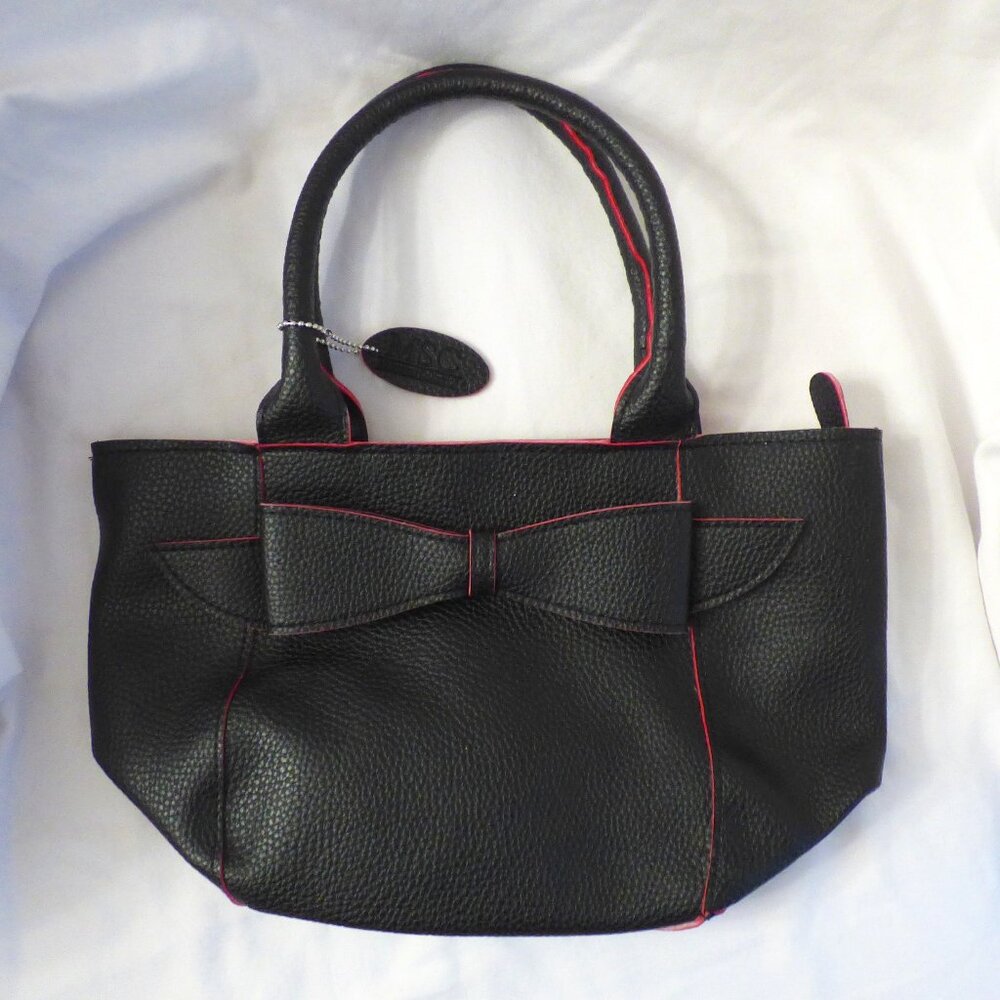 MSC Mainstreet Collection pebbled faux leather purse bag with bow, black w/ pink
